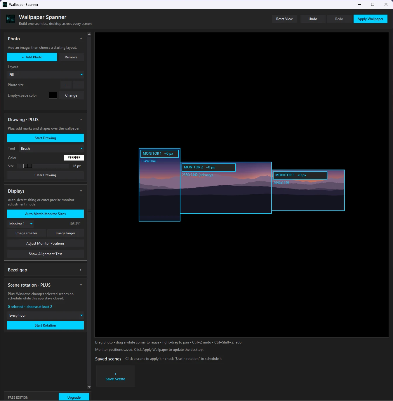 The Wallpaper Spanner workspace: a photo placed across three detected monitors, with photo, drawing, display, bezel, and rotation panels in the sidebar.